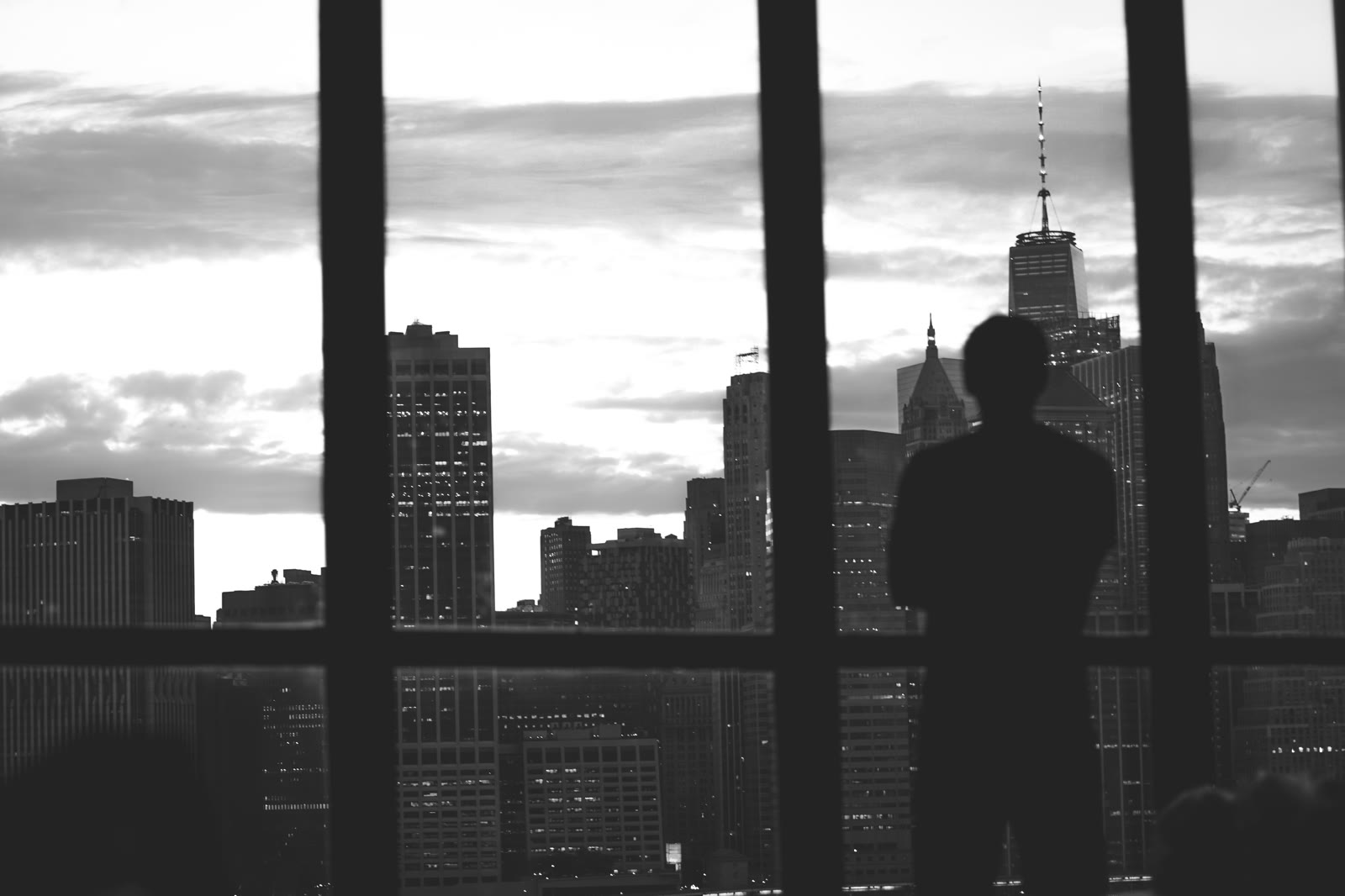Executive overlooking the city before a decision
